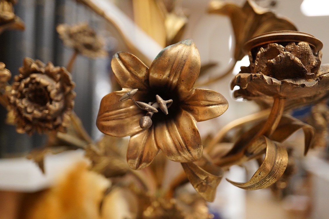 A pair of 19th century brass four light figural candelabra with inset enamel plaques, 48cm high